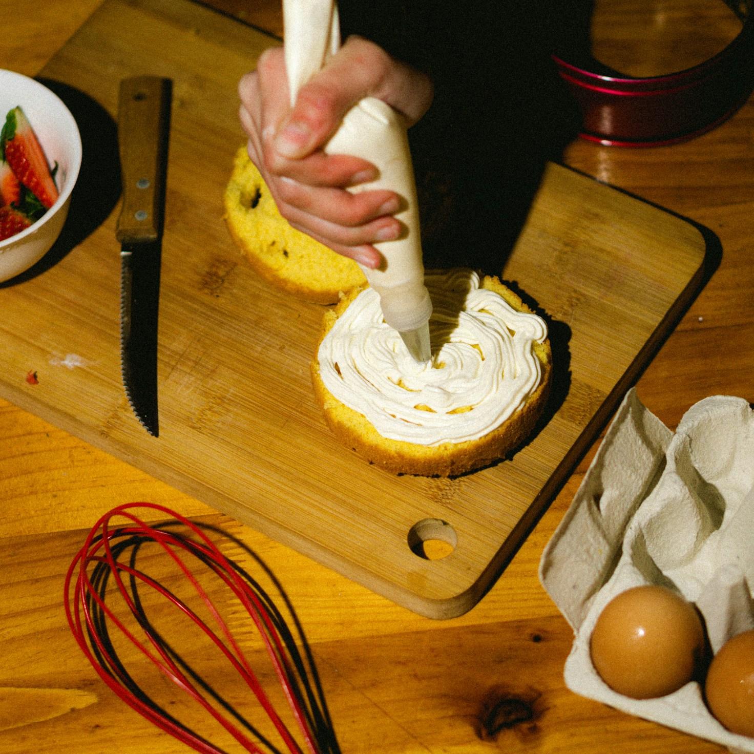 People working together in a contemporary kitchen, exchanging recipes and cooking tips